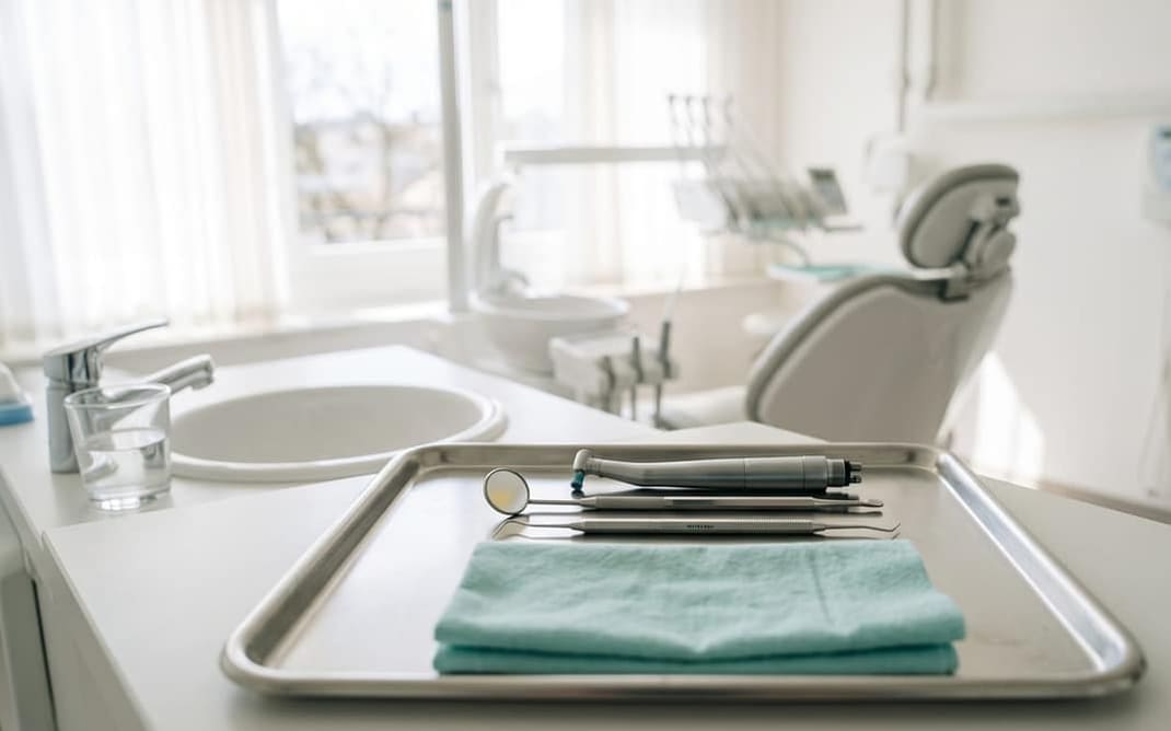 Dental instruments neatly arranged on a clean tray